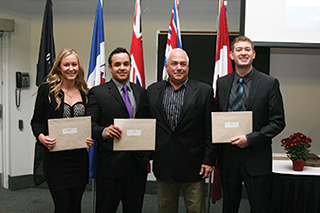 Shannon Douglas, William Banting and Robert Scott (far right) receive Canadian Association of Japanese  Automobile Dealers Scholarships from Jim Smith, Program Faculty