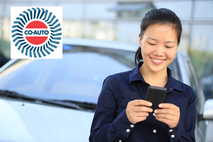 asian businesswoman use smart phone leaning on car/outside of of
