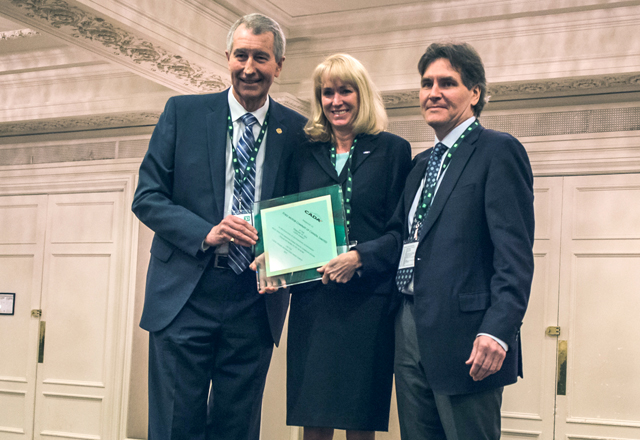 Ford: Ron Loveys,Senior Past Chairman, CADA, Dianne Craig, President and CEO Ford Motor Company of Canada, Ltd. Tim Ryan, Director, Industry Relations and General Counsel, CADA. 