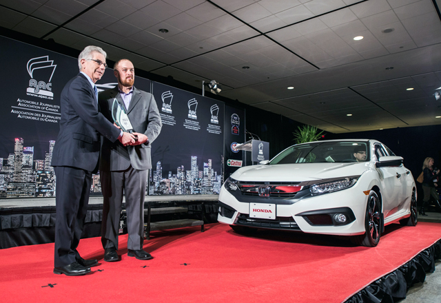 Jerry Chenkin, President and CEO of Honda Canada Inc. accepts the award for Honda 