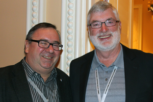 Denis Ducharme, MDA President and Robert Austin, iBeam, share a smile at the Western Canadian Dealer Summit in Las Vegas, Nev.