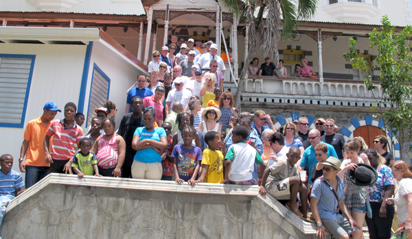 TADA members and stakeholders pose with children from Dunnottar School in Saint Lucia